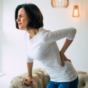 Woman with back pain needing pain management